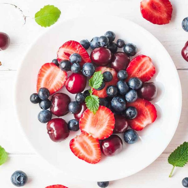 mixed berries on a white plate