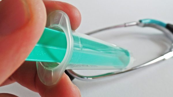 green syringe with cap
