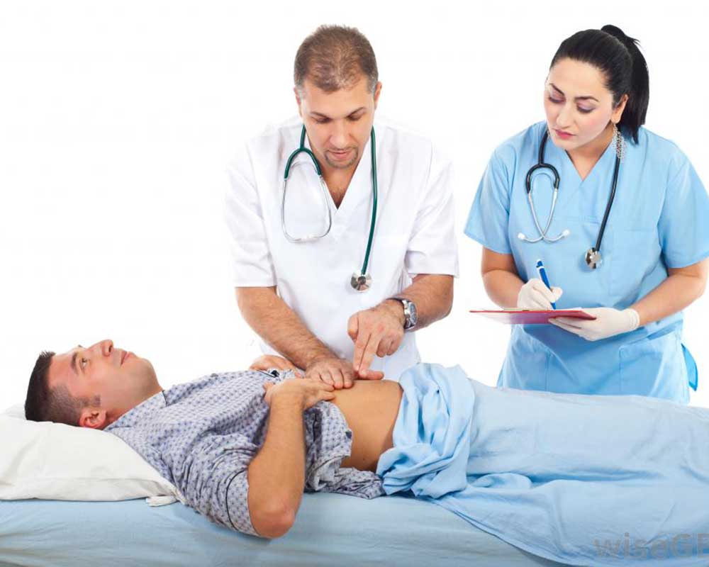 doctors checking the patient's abdomen