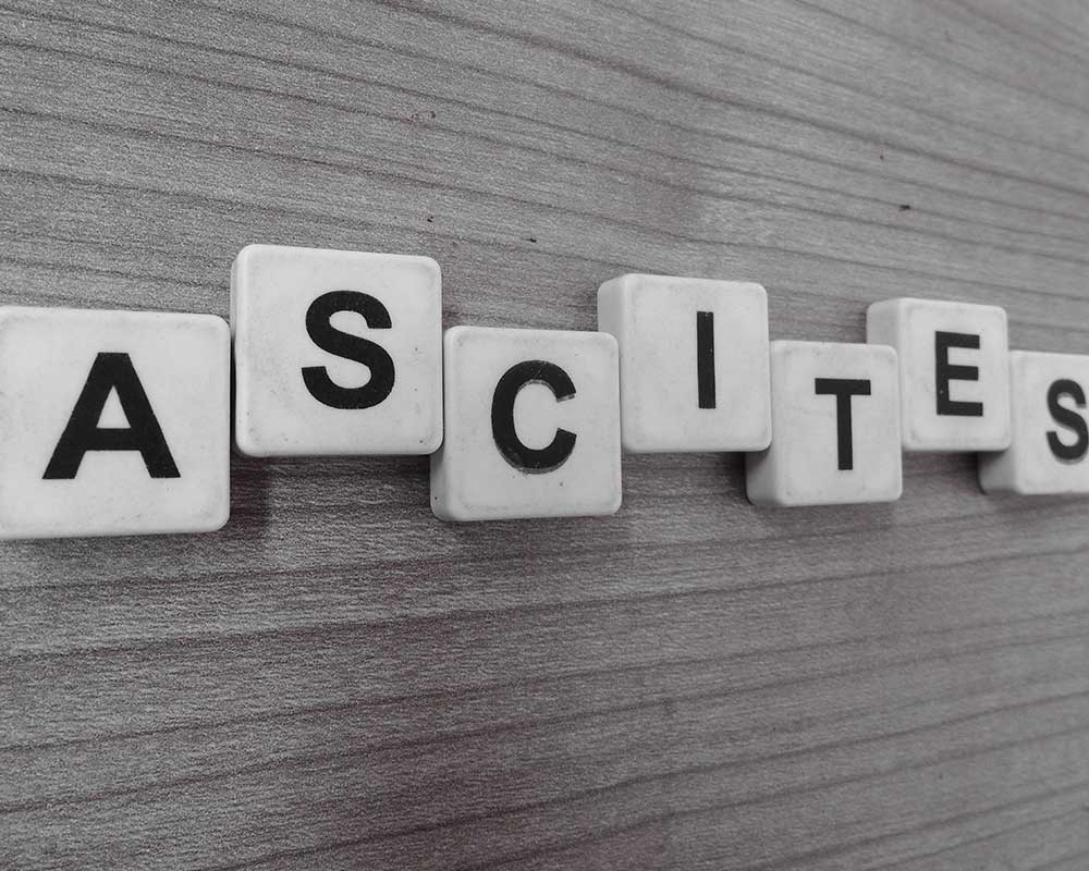 tiles with letters formed a word ascites