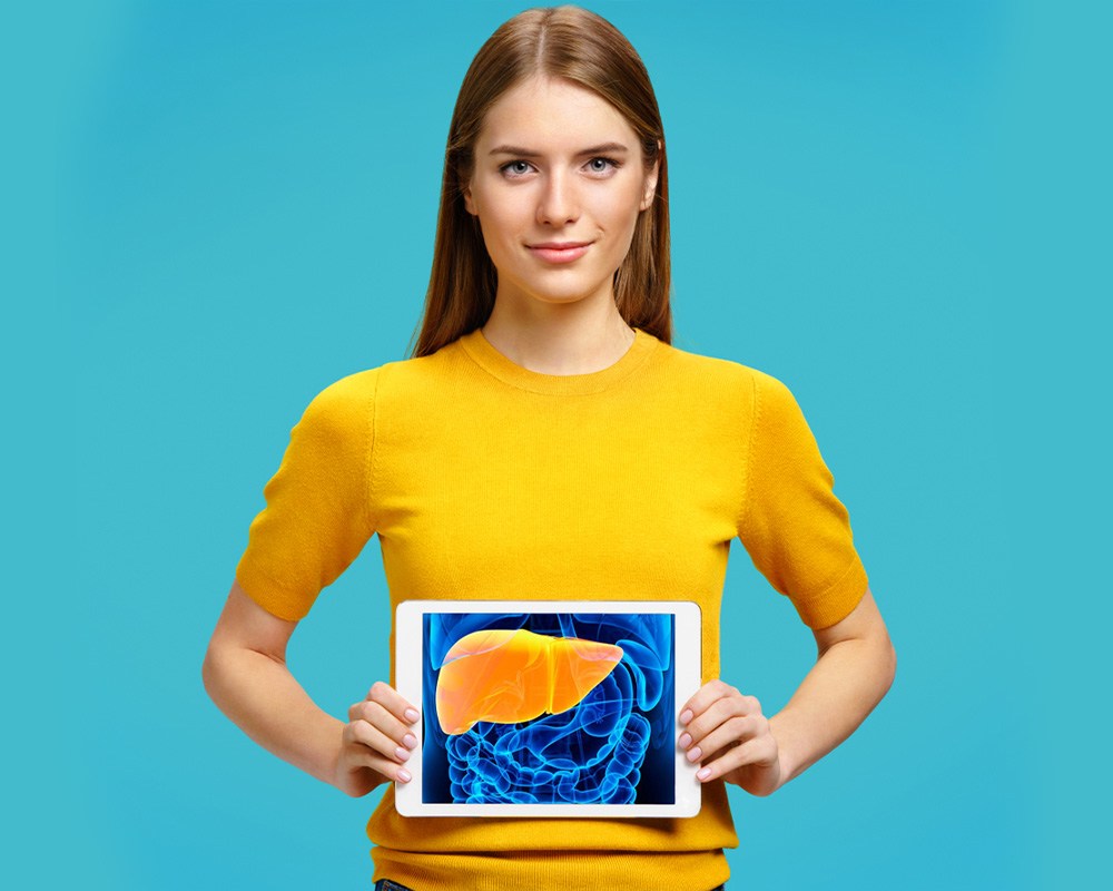 woman holding a picture of human liver
