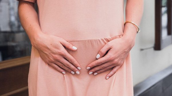 Pregnant woman in peach dress
