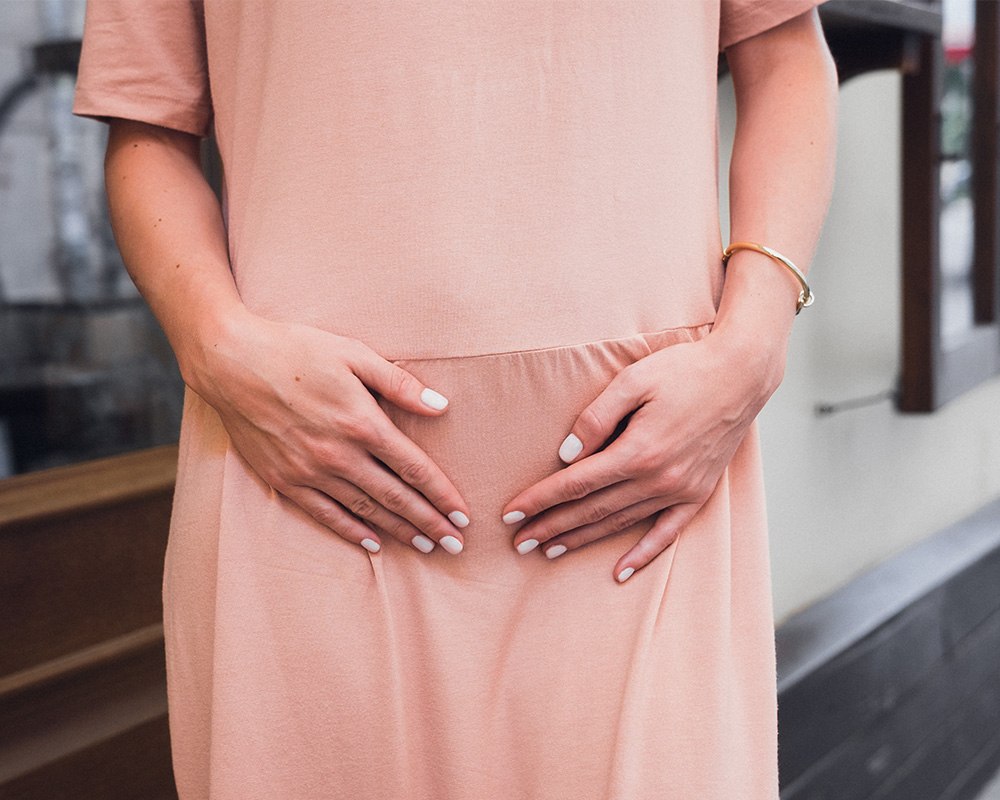 Pregnant woman in peach dress